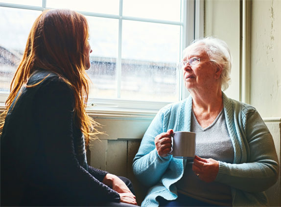 A patient being supported by a healthcare worker